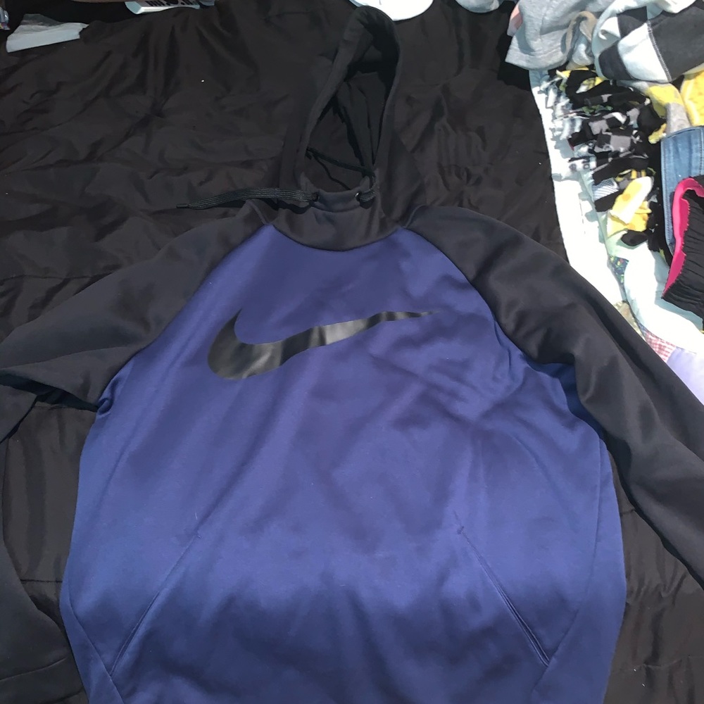 A black and blue nike dri-fit hoodie.